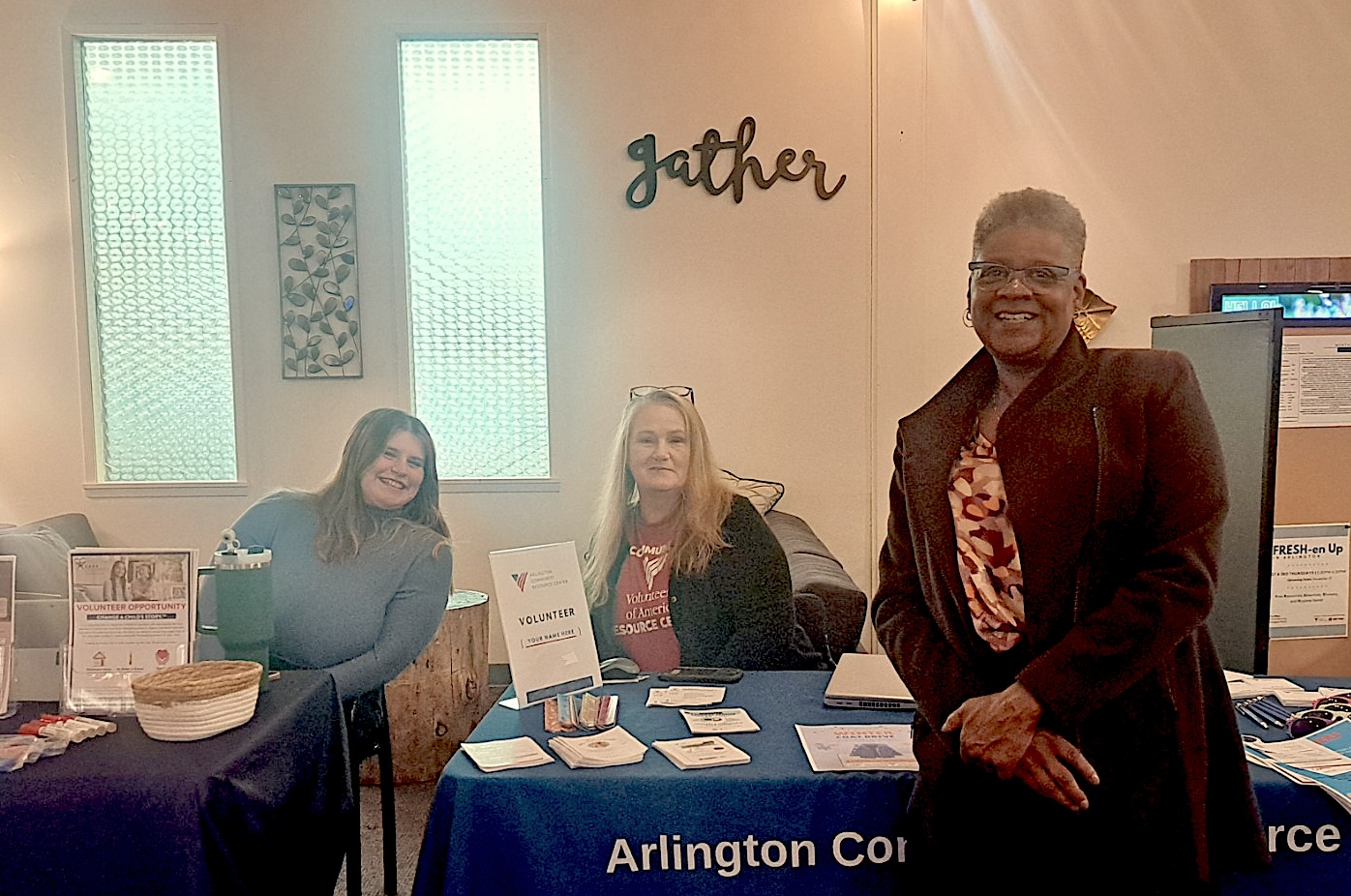 Three people at a Marysville Volunteer Fair in Nov. 2024